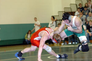 Celina's Eric Braun, right, tries to fight out of the grip of Wapakoneta's Andrew Maitlen. Braun lost his match to Maitlen, 4-1, as the Redskins beat the MatDogs 41-24 on Thursday.<br></br>dailystandard.com