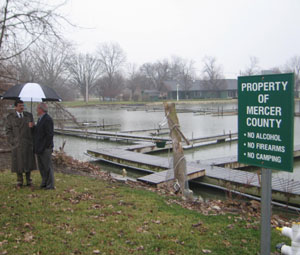 Mercer County Prosecuting Attorney Andy Hinders and county Commissioner Jerry Laffin survey the newly purchased boat docks just off county-owned land at the 4-H camp near Harbor Point. The county bought some of the docks for $20,000 to avoid taking a local marina to court over the issue.<br></br>dailystandard.com