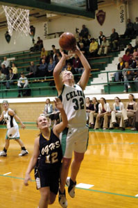 Celina's Laura Link, 32, shoots over Ottawa-Glandorf's Emily Langhals, 12, at the Fieldhouse on Thursday night.<br></br>dailystandard.com