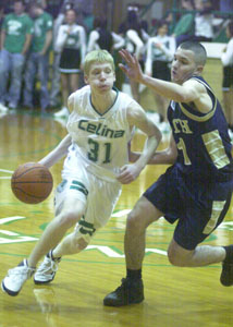 Celina's Kyle White, 31, drives past Bath's Brock Best, right, during their game at the Fieldhouse on Friday night. Bath defeated Celina, 60-46.<br></br>dailystandard.com