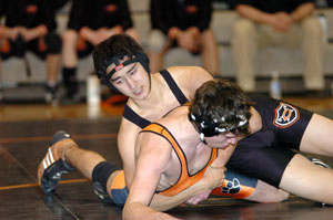 Coldwater's Nate Sides locks up Versailles' Alex Cox in a 145-pound bout at the MAC Triangular Match on Saturday at Coldwater. Sides won the bout as Coldwater went 2-0 on the evening.<br></br>dailystandard.com