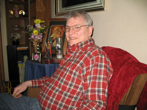 Minster resident Darrell Kelbel sits beside a shrine at his 124 N. Lincoln St. home. Kelbel, an employee of The Dannon Co., recently underwent an experimental procedure for inoperable liver cancer.<br></br>dailystandard.com