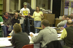 Parkway wrestling proponents Kim Green and her son, Carl Green III, address the Parkway Local Schools board of education about adding wresting to the school district's sports program.<br></br>dailystandard.com