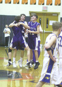 Fort Recovery players celebrate following the Indians' 48-47 double-overtime victory over Marion Local on Tuesday night in Division IV sectional final action at The Palace in Coldwater. The Indians, who hadn't won a league game during the regular season, will now look to make it two in a row on Friday night against top-seeded New Bremen.<br></br>dailystandard.com