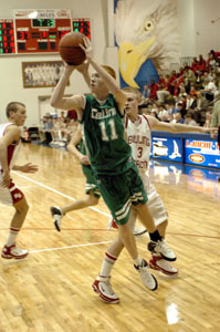 Celina's Brian Dorsten, 11, ducks inside the Bowling Green defense for two of his 11 points during the Bulldogs' Division I sectional semifinal contest against Bowling Green on Wednesday.<br></br>dailystandard.com