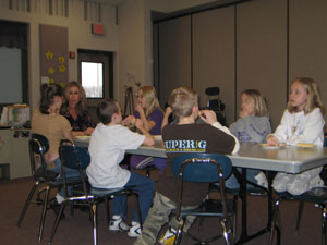 Elementary music teacher and part-time guidance counselor Jayne Evans directs her lunch bunch: Abby Grube, Journey Bechtol, Taylor Guggenbiller, Leah Bihn, Sam Huelskamp, McKinley Timmerman and Katie Braun munch on popcorn and marshmallow treats before talking about respect and disrespect.<br></br>dailystandard.com