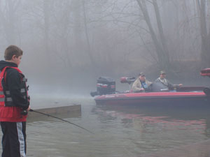 Caleb Madaj of Coldwater fishes for crappie from the docks at Windy Point on Sunday. Heading out to the lake for more crappie fishing are Larry Cunnagin and Jeff Hoenie, both of the Montezuma area. Local fishermen are gearing up for the first crappie tournament on the lake on April 22, with catfish tournaments starting Saturday. Skill, gear, weather and luck contribute to how big and how many fish competitors will bring back. Tournament fishing is typically open to the public and brings anywhere from 12 to 400 boats onto the water for each competition.<br></br>dailystandard.com