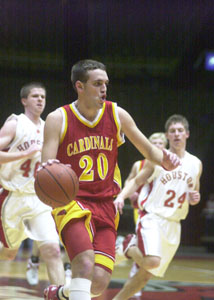 New Bremen's Allan Webster, 20, looks up the court ahead of the Houston defense during their Division IV regional semifinal contest on Tuesday night in Oxford. Houston defeated New Bremen, 54-52.<br></br>dailystandard.com