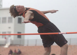 Coldwater's Devin Swartzel clears the bar during the high jump competition during a Cavaliers' quadrangular meet on Tuesday. Swartzel won three events to help the Cavaliers to a lopsided victory over the rest of the field on the boys' side.<br></br>dailystandard.com