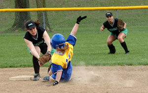 St. Marys' Toya Anderson, 13, tries to stretch a single into a double by sliding into second base but Celina shortstop Allison Braun, left, is waiting with the ball for the out. Celina leftfielder Kelsey Moorman, right, looks on from the outfield with anticipation. Celina defeated St. Marys in the Western Buckeye League opener 1-0 in eight innings to improve to 7-0.<br></br>dailystandard.com