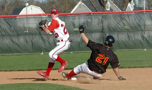 St. Henry's Josh Werling, 23, comes off second base after recording an out as New Bremen's Anthony Moeder, 21, slides during Tuesday's Midwest Athletic Conference matchup at the Wally Post Athletic Complex. St. Henry defeated New Bremen, 12-2 in five innings.<br></br>dailystandard.com