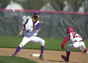 St. Henry's Josh Werling, right, begins to slide into second base as Fort Recovery's Clint Tobe, 32, takes the throw from the catcher during their makeup Midwest Athletic Conference contest on Wednesday at the Wally Post Athletic Complex.<br></br>dailystandard.com