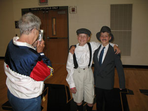 Wilbur and Orville Wright (alias Andy Albers and Jarod Schmitmeyer) pose for visitor Marilyn Schmitmeyer on Tuesday afternoon. The two friends settled on the Wright Brothers as a class assignment. See related photo on back page.<br></br>dailystandard.com