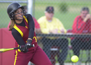 New Bremen's  Jennifer Dick laces a single for the Cardinals during Division IV sectional final action on Tuesday. New Bremen defeated Fort Recovery, 1-0.<br></br>dailystandard.com