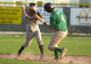 Parkway's Eddie Burtch, left, steps on second base for an out and tries to throw around Celina's Derek Gagle, right, to first base during the fifth inning on Tuesday night during ACME action at Eastview Park.<br></br>dailystandard.com