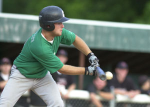 Celina's Matt Paulus bunts for a base hit during an ACME game against Fort Loramie on Tuesday night at Eastview Park. Celina trailed 7-1 before losing to Fort Loramie, 10-9.<br></br>dailystandard.com