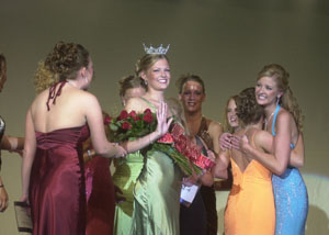 Newly crowned 2006 Miss Lake Festival Queen Erica Gelhaus is flanked by congratulatory queen pageant contestants at the conclusion of Monday night's event. The scholarship pageant is the traditional precursor of this weekend's Celina Lake Festival. See related photos on back page.<br></br>dailystandard.com