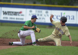 Lake Erie's Kevin Leady, 4, slides into second base for a stolen base just before Grand Lake shortstop Bryant Witt, left, can put the tag on during their Great Lakes Summer Collegiate League contest on Thursday night at Jim Hoess Field. The Mariners won their fifth straight game with a 3-0 shutout victory over Lake Erie.<br></br>dailystandard.com