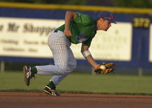 Grand Lake shortstop Bryant Witt fields the ball on the run during the Mariners' Great Lakes Summer Collegiate League tournament opener against Columbus at Jim Hoess Field on Wednesday night. Grand Lake pulled an upset over GLSCL regular-season champion Columbus as the Mariners edged the All-Americans, 7-6.<br></br>dailystandard.com