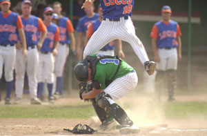 Lima's Drew Hoisington, 18, tries to score over Grand Lake catcher Dock Doyle, bottom, during their Great Lakes Summer Collegiate League tournament game on Saturday at Shawnee Field. Hoisington was out on the play.<br></br>dailystandard.com