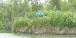 The shoreline of Prairie Creek Island in Grand Lake is quickly washing away due to wave and wind action, which puts more sediment in the lake. Lake supporters during a summit on the lake Wednesday at Wright State University-Lake Campus said more money is needed for shoreline protection.<br></br>dailystandard.com