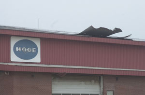 Damage is visible to the roof of one of the buildings at Hoge Lumber Co. in New Knoxville, near the spot where a confirmed tornado touched down Monday evening. Fifteen homes also sustained damage from the F0 tornado, the weakest designation for tornadoes given by the National Weather Service.<br></br>dailystandard.com