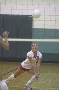 St. Henry's Janel Bruns goes down low for a dig during the Redskins' match against Celina on Tuesday night. Bruns and the Redskins rolled past the Bulldogs in three games, 25-19, 26-24 and 25-19.<br></br>dailystandard.com