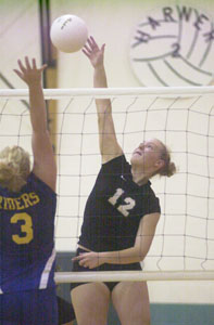 Celina freshman Cenzie Yoder, 12, spikes the ball past St. Marys' Rachel Ginter, 3, during their Western Buckeye League match on Tuesday night. Celina won in three games, 25-12, 25-15, and 25-13.<br></br>dailystandard.com