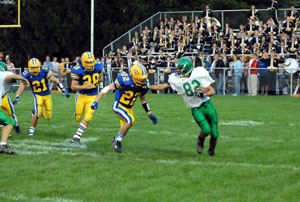 Celina's Zach Sams, 82, tries to stiff arm St. Marys' Marcus Sheipline, 22, during the Battle of Grand Lake on Friday night at Skip Baughman Stadium. St. Marys defeated Celina, 21-8.<br></br>dailystandard.com