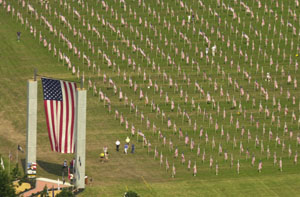 Twin towers bearing a huge American flag form the entrance to the West Ohio Healing Field at the Spiritual Center of Maria Stein. Some 3,500 smaller flags honor fallen soldiers, men and women currently serving in the military, veterans, firefighters, police officers and emergency medical services personnel. The observance, which began Saturday morning, continues through 5 p.m. Tuesday.<br></br>dailystandard.com