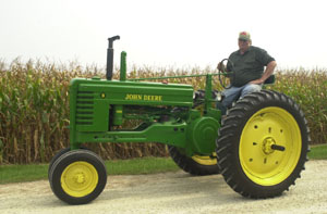 John Moeller, St. Marys, sits on his 1952 John Deere Model B tractor, one of the two tractors he plans to drive in the first Antique Tractor Poker Run planned on Sept. 23 in Auglaize County. Moeller is one of the organizers of the event, which will raise funds for the St. Marys Community Youth Center and the Auglaize County Law Enforcement Shop With a Cop program.<br></br>dailystandard.com