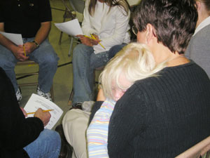 Two-year-old Ava Gottschalk snoozes on Grandma Sue Eymer's shoulder during a break-out session at a public meeting to discuss school facilities in St. Marys. <br></br>dailystandard.com