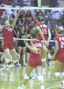 St. Henry volleyball players celebrate after a four-game win over Mercer County rival Coldwater on Thursday night in a Midwest Athletic Conference showdown. St. Henry won by scores of 25-22, 25-23, 22-25 and 27-25.<br></br>dailystandard.com