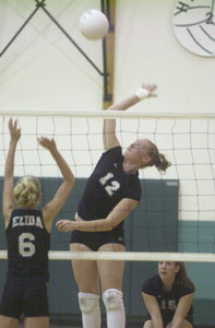 Celina's Cenzie Yoder, 12, spikes the ball past an Elida defender during their Western Buckeye League match on Thursday night at the Intermediate School. Celina improved to 5-0 in the WBL following a dominating three-game win over Elida, 25-12, 25-8 and 25-12.<br></br>dailystandard.com