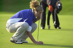 Marion Local's Abby Hartings lines up her putt during the Midwest Athletic Conference girls golf tournament on Saturday at The Fox's Den. Hartings had the best score for Marion Local with a 107.<br></br>dailystandard.com