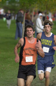 Coldwater's David Wilker, left, pushes on ahead of Lehman's Tony Reiss during the Lions Invitational on Thursday. Wilker won the race.<br></br>dailystandard.com