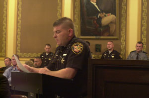 Mercer County Sheriff's Deputy Doug Timmerman reads from a victim impact statement Friday in Mercer County Common Pleas Court. Ricky D. Driskill, Modoc, Ind., was to be sentenced for an incident last year during which he lunged at Timmerman with a box cutter knife and Timmerman shot him. His sentencing was delayed until Thursday.<br></br>dailystandard.com