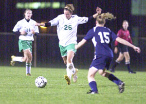 Celina's Shelbi Nation, 26, dashes down field against Napoleon during Tuesday's Division I girls soccer sectional at Findlay. Nation had a goal and an assist to help the Bulldogs beat the LadyCats 3-0.<br></br>dailystandard.com