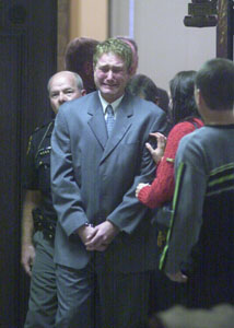 Ricky Driskill weeps while being led from Mercer County Common Pleas Court by Lt. Matt Grunden of the Mercer County Sheriff's Office. The Indiana man was sentenced to seven years and four months in prison on charges of felonious assault of a police officer, theft of a motor vehicle and vehicular assault.<br></br>dailystandard.com