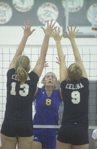 Celina's Liz Homan, 13, and Allison Thobe, 9, put up a big block in front of St. Marys' Emily Shellabarger, 8, during their postseason match on Saturday at Lima Senior High School. Celina won the match in three, 25-9, 25-17 and 25-10.<br></br>dailystandard.com