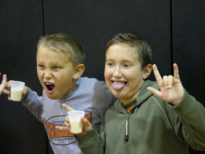 Fourth-graders Kyle Welsch, left, and Devin Rindler show off their milk mustaches at the conclusion of a dairy nutrition program at Coldwater Elementary School on Monday.<br></br>dailystandard.com