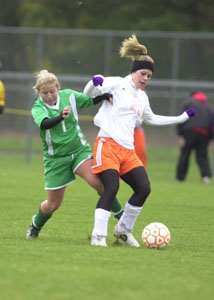Celina's Jenna Reineke, left, tries to defend Elida's Kylie Prince, right, during their Division I sectional final contest on Monday at Graham Soccer Stadium in Findlay. Celina's season came to an end after Elida won, 2-0.<br></br>dailystandard.com