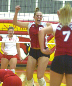 New Knoxville's Nicole Wright shows her excitement after the Rangers won their Division IV district semifinal contest against St. Henry at New Bremen High School on Thursday night. New Knoxville won the match in five games.<br></br>dailystandard.com