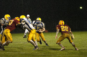 Marion Local's Marc Otte, 33, follows a block by a teammate during their game against New Bremen on Friday night. Marion Local defeated New Bremen, 34-0<br></br>dailystandard.com