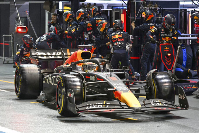 Red Bull driver Max Verstappen of the Netherlands steers his car out of pit lane during the Singapore Formula One Grand Prix, at the Marina Bay City Circuit in Singapore, Sunday, Oct. 2, 2022. (Mohd Rasfan/Pool photo via AP)