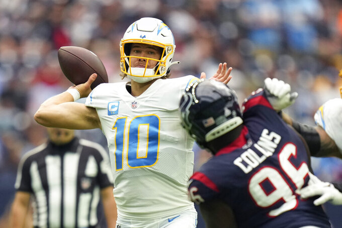 Los Angeles Chargers quarterback Justin Herbert (10) throws against the Houston Texans during the first half of an NFL football game Sunday, Oct. 2, 2022, in Houston. (AP Photo/Eric Christian Smith)