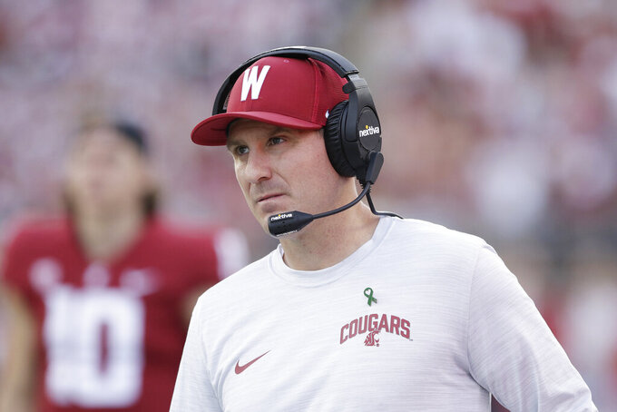 FILE - Washington State head coach Jake Dickert walks along the sideline during the second half of an NCAA college football game against California, on Oct. 1, 2022, in Pullman, Wash. Dickert has agreed to a contract extension that will keep him tied to the Cougars through the 2027 season. (AP Photo/Young Kwak, File)