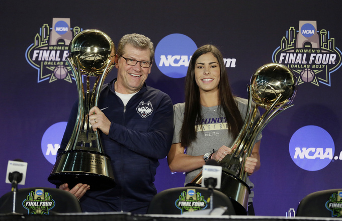 FILE - Connecticut head coach Geno Auriemma, left, and Washington's Kelsey Plum, right, hold their respective trophies after they were named The Associated Press Women's Basketball Coach of the Year and AP Women's Player of the Year at the women's NCAA Final Four college basketball tournament, Thursday, March 30, 2017, in Dallas. The Associated Press will announce the men’s and women's college basketball player and coach of the year awards this week. The women's awards will be announced on Thursday, March 30, 2023, the men's on Friday. (AP Photo/Tony Gutierrez, File)