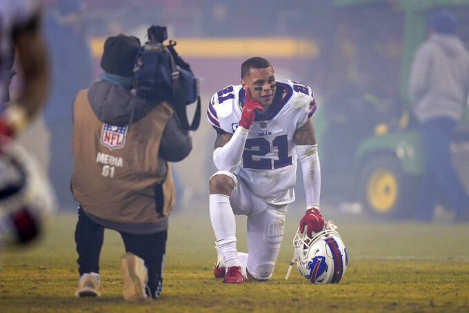 Buffalo Bills free safety Jordan Poyer (21) kneels on the field after an NFL divisional round playoff football game against the Kansas City Chiefs, Sunday, Jan. 23, 2022, in Kansas City, Mo. The Chiefs won 42-36 in overtime. (AP Photo/Ed Zurga)