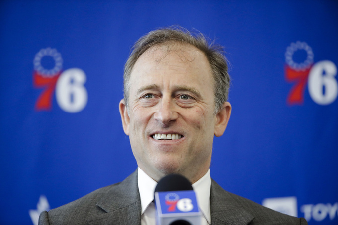 FILE - Philadelphia 76ers owner Josh Harris speaks with members of the media during a news conference at the NBA basketball team's practice facility in Camden, N.J., Tuesday, May 14, 2019. Two people with knowledge of the situation tells The Associated Press a group led by Josh Harris and Mitchell Rales has submitted a fully financed bid for the NFL's Washington Commanders. The Harris/Rales group, which includes basketball Hall of Famer Magic Johnson, is one of multiple bidders involved in the sale process .(AP Photo/Matt Rourke, File)